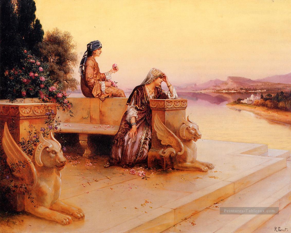 Élégantes Arabe Dames sur une terrasse au coucher de soleil Arabian peintre Rudolf Ernst Peintures à l'huile
